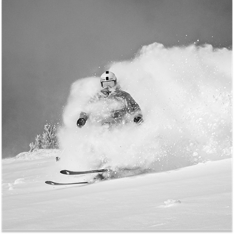 JT Holmes blowing though powder