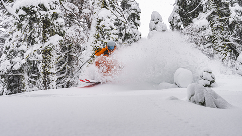 Amie Engerbretson skiing pow off of Resort Chair