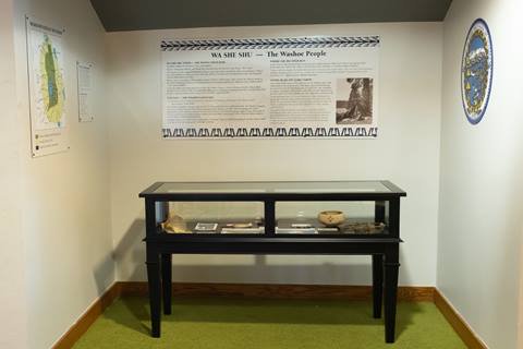 The Washoe Display at High Camp, showing a display case and associated signs.
