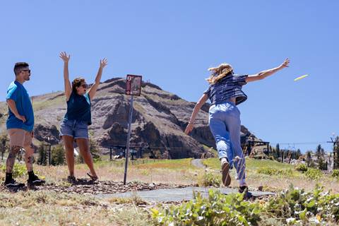 Excited disc golfers playing the course at High Camp