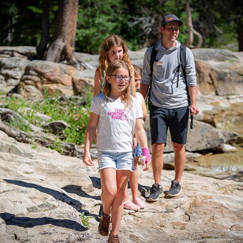 Three girls on a hike during Kids Adventure Camp