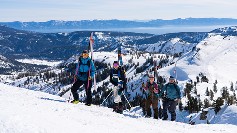 4 skiers hiking up for Alpenglow Expeditions' Backcountry 1.0