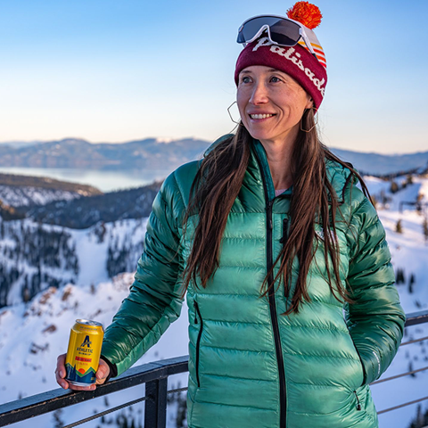 Woman having an Athletic Brewing at High Camp