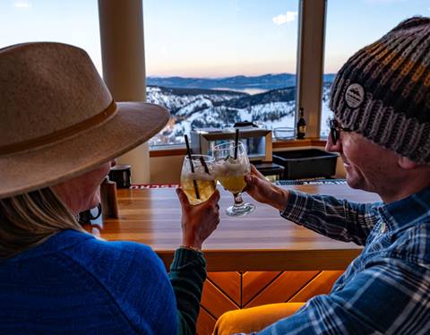 Couple doing cheers at High Camp