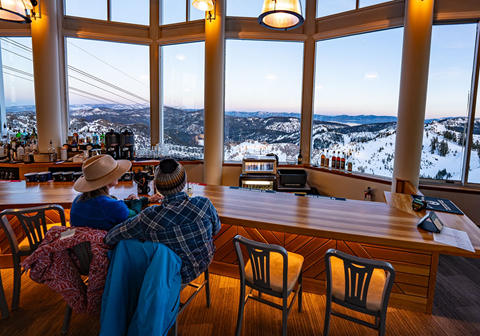 Couple looking out at view at High Camp's Terrace Bar