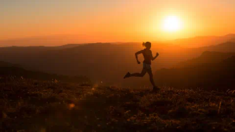 Trail running at sunrise