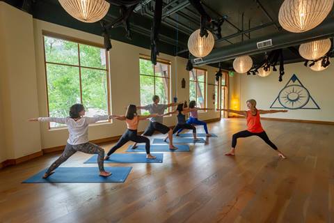 People enjoying yoga at Palisades Tahoe 