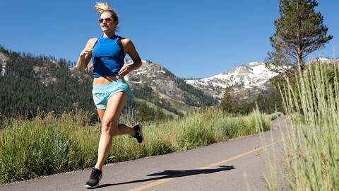 Girl running through Olympic Valley 
