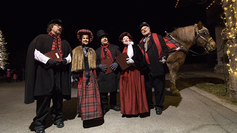 Christmas carolers in The Village