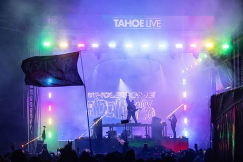 Tahoe Live performer on stage surrounded by colorful lights