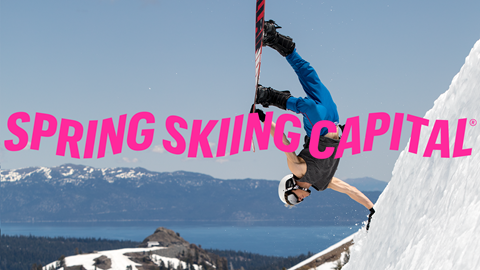 Spring Skiing Capital logo with snowboarder on a bluebird day.