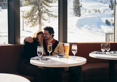 Couple cuddling and smiling at Apex Lounge