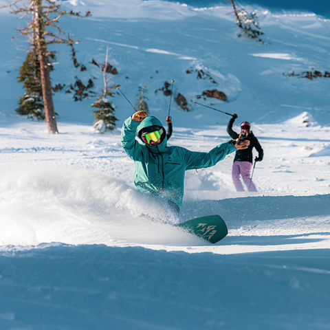 Snowboarder pow slash at Palisades Tahoe