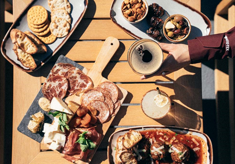 Charcuterie board on the deck at Oro Bar - An Apex Offering