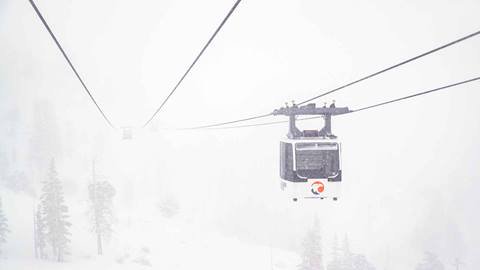 A cabin from the Base to Base Gondola during a snowstorm in December.