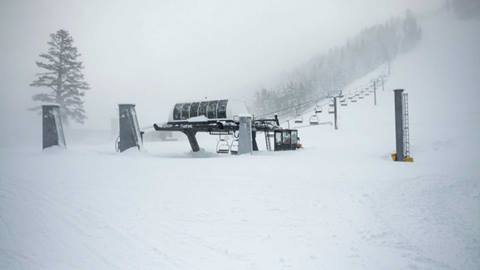 A snowy Red Dog chairlift at Palisades Tahoe.