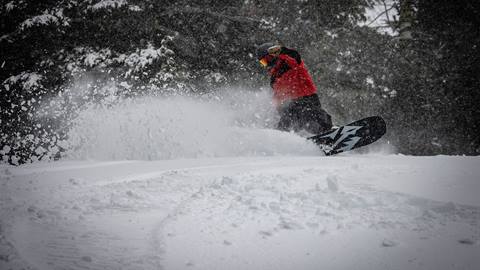 Snowboarder pow slash