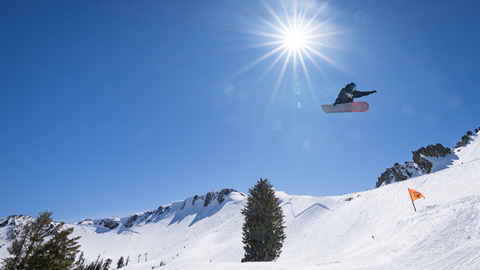 Rider in the park hitting a jump