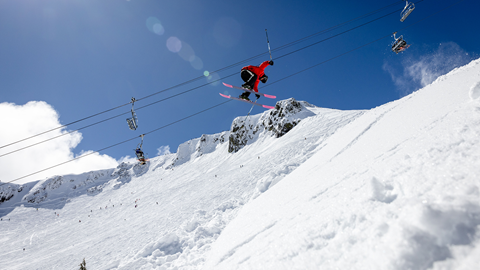 Skier taking flight on April 16, 2026 at Palisades Tahoe