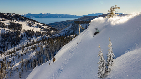 Snowboarder heel side spray at Alpine