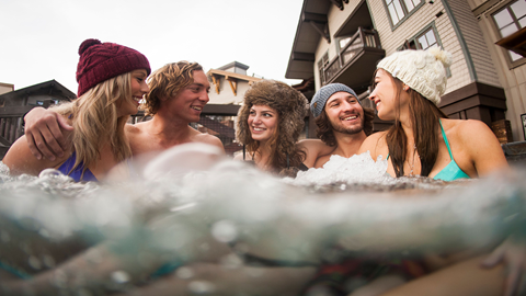 Photo of people in a hot tub at Palisades Tahoe.