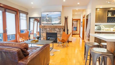 A living room in one of the premier 3 bedroom units in The Village at Palisades Tahoe.