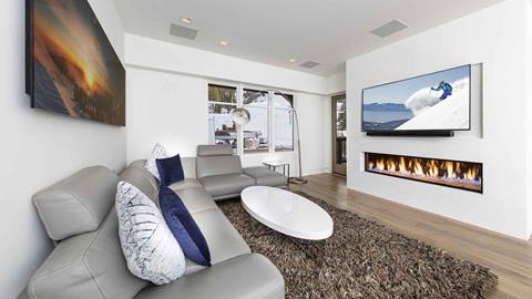 The fireplace in the Snow King Suite in The Village at Palisades Tahoe.