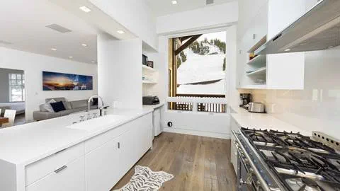 The light-filled modern kitchen of the Snow King Suite in The Village at Palisades Tahoe.