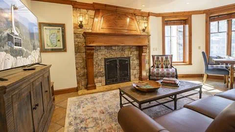 The stunning stone fireplace in the Eagles Nest Suite.