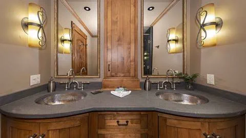 A bathroom with double vanity in the Alpine Room Suite.