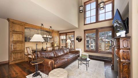 The living area of the stunning Alpine Room in The Village at Palisades Tahoe.