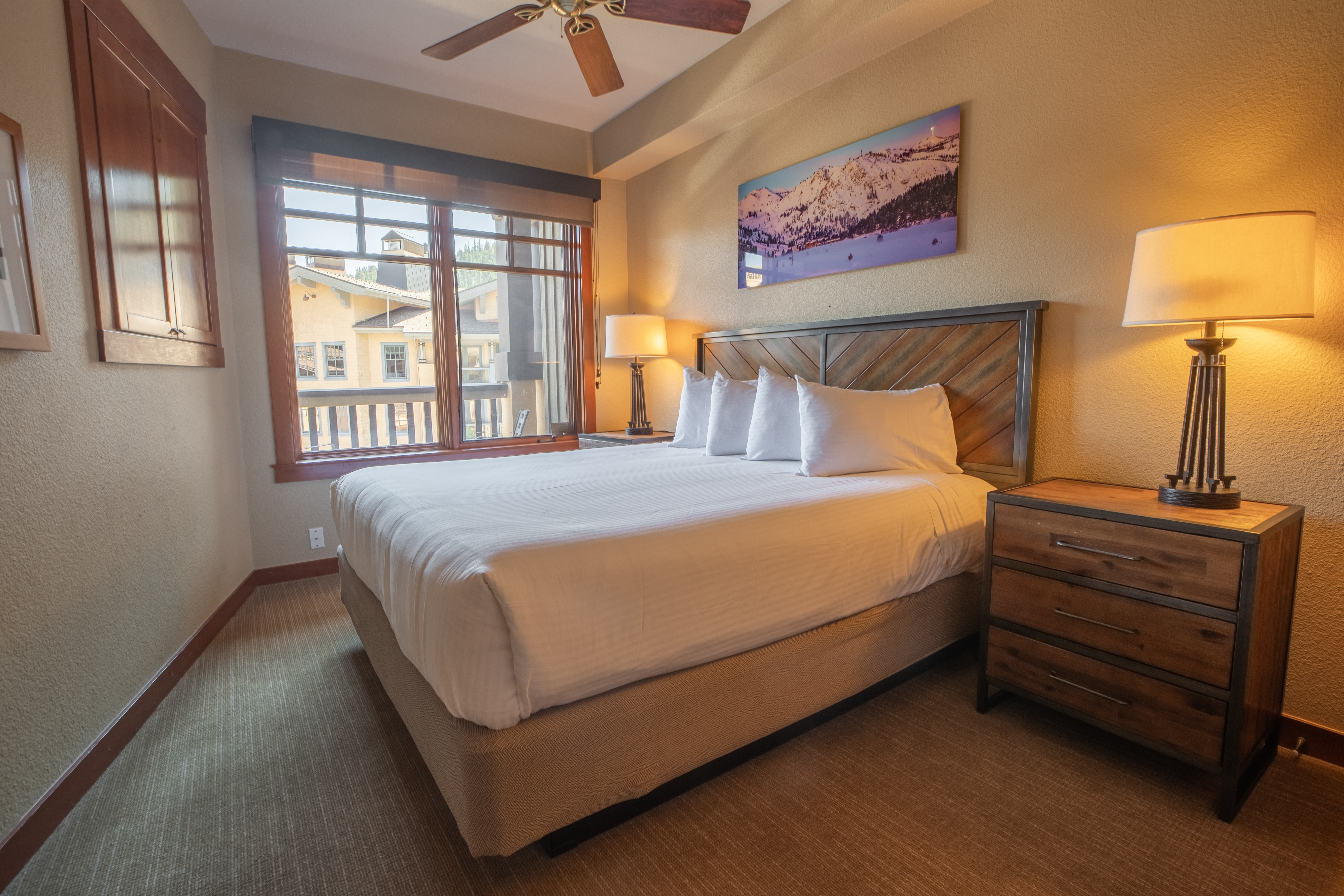 Cozy premier bedroom suite with a scenic view of The Village of Palisades Tahoe