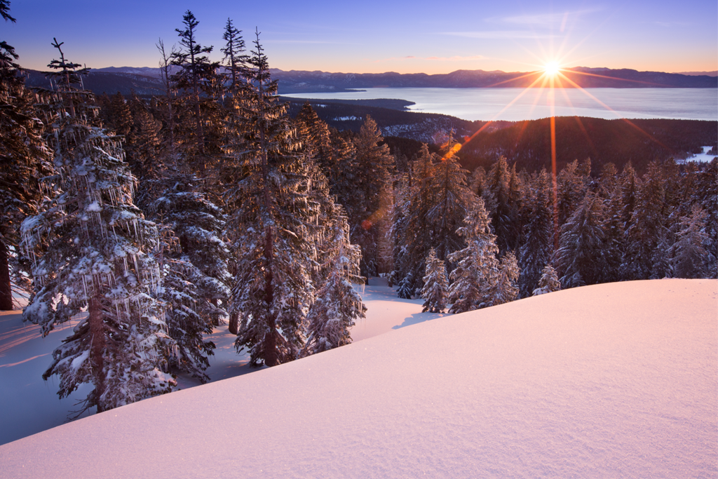 Sunrise over Lake Tahoe and Palisades groomer