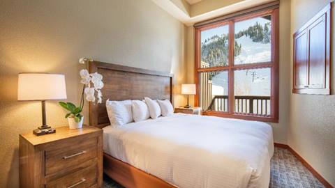 A One Bedroom Suite with a view of the Red Dog ski area at Palisades.