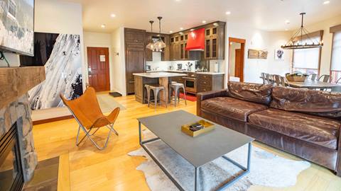A Three Bedroom Suite featuring a sitting area and kitchen in The Village at Palisades Tahoe.