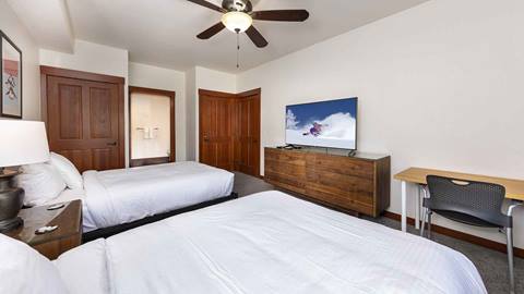 The second bedroom with two queen beds in the Tram Face Suite.