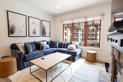 Living room at Premier Plus suite with view into The Village at Palisades Tahoe