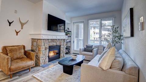 The sitting area of the Sugar Pine Suite in The Village at Palisades Tahoe hotel. 