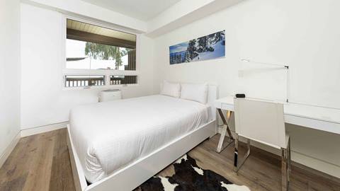The bright and airy second bedroom in the Snow King Suite.