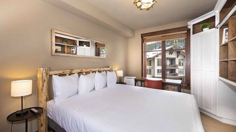 A second view of the master bedroom in the Alpine Room Suite.
