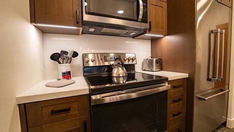 Kitchen with pictured stove inside of Red Dog Retreat Room.
