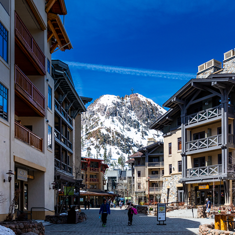 The Village at Palisades Tahoe with Tram Face in the background