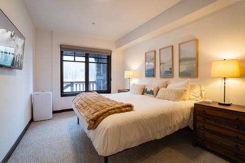Interior image of a bedroom in the Douglas Fir suite