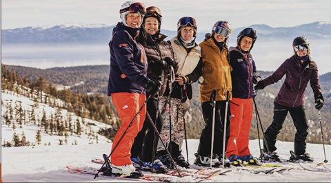 Happy skiers in a group lesson. 