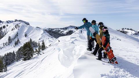 A group lesson hiking to more terrain at Alpine.