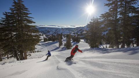 Snowboarders on slopes