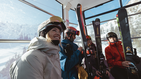 Group of friends taking the Funitel up