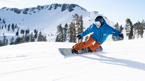 Snowboarder making a toe side carve