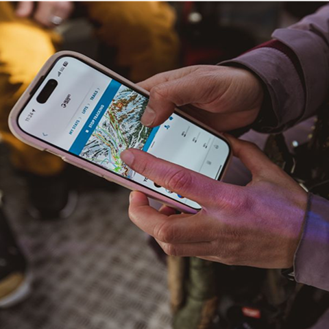 Person looking at iPhone to see trails