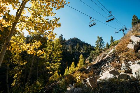 Scenic view of the mountains from a perspective below a chairlift